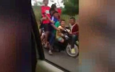 فيديو طريف.. 7 اطفال ورجل واحد على دراجة نارية صورة رقم 3