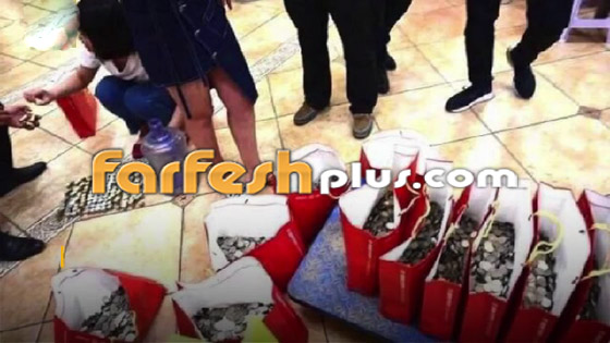 بائع متجول صيني يشتري شقة بـ20 زجاجة مياه مملوءة بالعملات المعدنية! صورة رقم 12