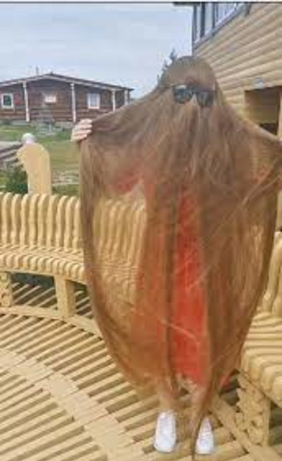 صور :رابونزل الروسية لم تقص شعرها منذ 23 عامًا صورة رقم 3