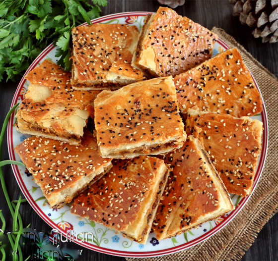 إليكم طريقة تحضير الرقاق باللحمة المفرومة لسفرة العيد صورة رقم 7