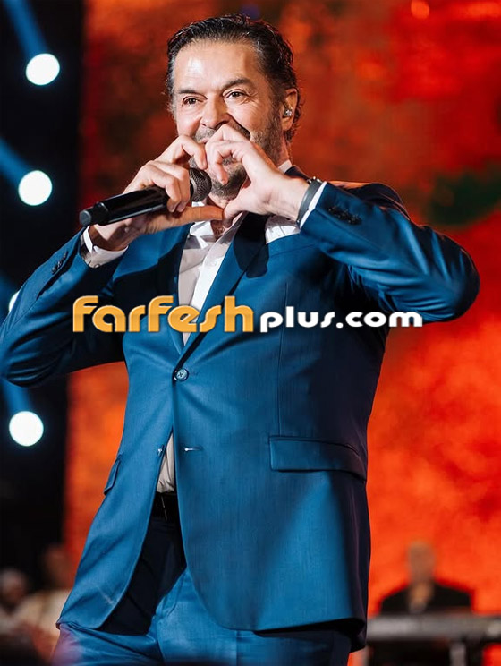 مُعجبة تُعانق راغب علامة على المسرح وتُقبل وجهه ويده والجمهور يعلَق: الله يعين مرتو! صورة رقم 7