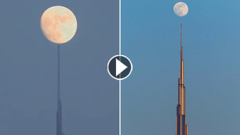 فيديو وصور: القمر يلامس قمة أعلى برج في العالم في دبي بلحظة مدهشة