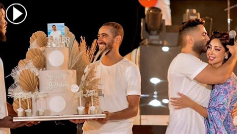 فيديو وصور: بسمة بوسيل تفاجئ زوجها تامر حسني بتورتة وعناق  على المسرح وتغني له