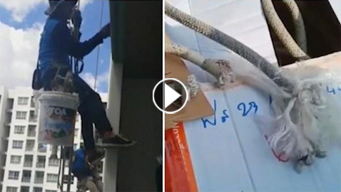 فيديو.. امرأة تقطع حبلا تعلق به عاملا طلاء من ارتفاع شاهق!