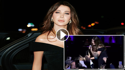 فيديو: معجب عراقي يضع نانسي عجرم بموقف محرج.. قبل يدها ورفض أن يفلتها! كيف تصرفت؟