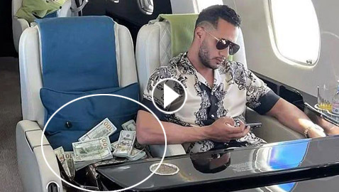 صور محمد رمضان (جعفر العمدة) يستعرض رزم دولارات داخل الطائرة، والبرلمان المصري يحقق!