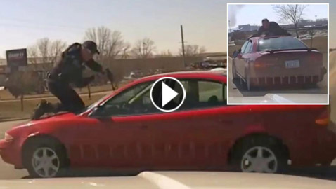 فيديو يحبس الأنفاس: شرطي تشبث بغطاء سيارة قادها سائقها بسرعة عالية!